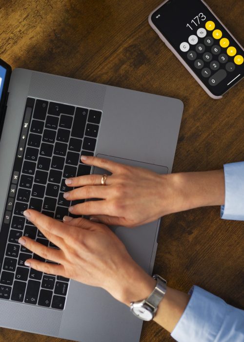 top-view-woman-typing-laptop